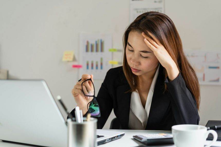 Stressed and depressed business woman working in office, Business failure concept